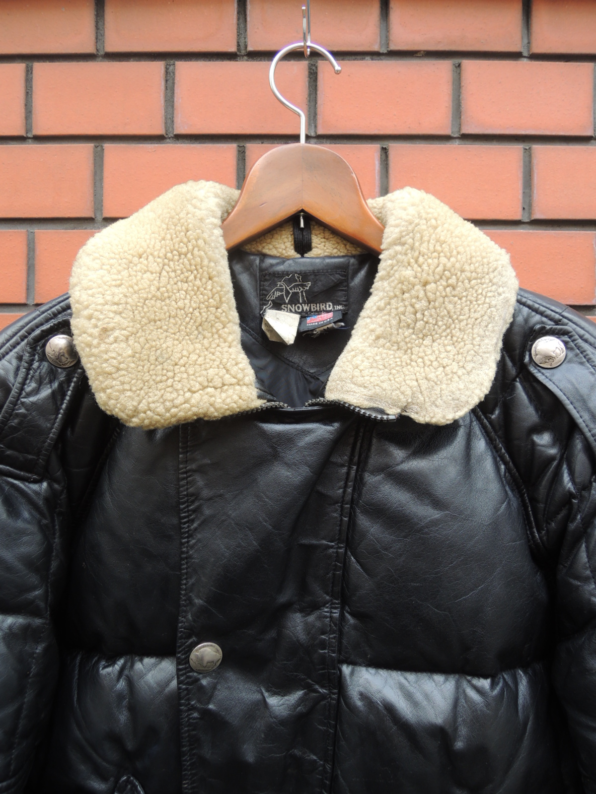 SNOWBIRD leather down jacket: container